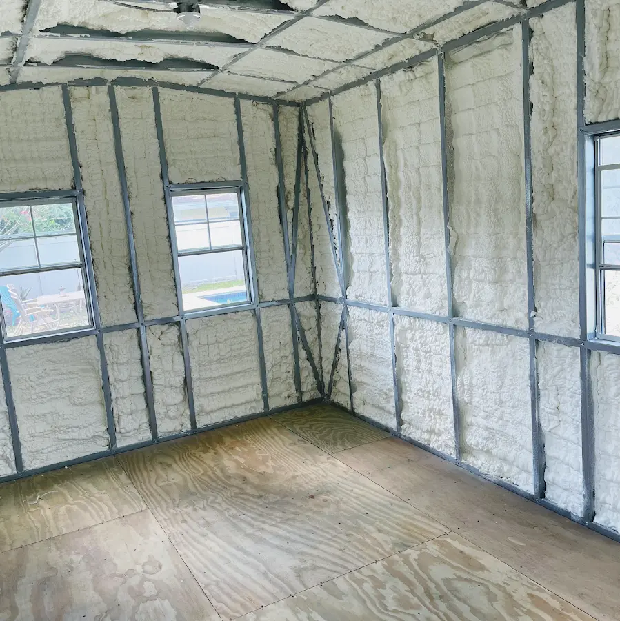 Closed-cell spray foam insulation applied to wall cavities in a residential project in Woodbridge